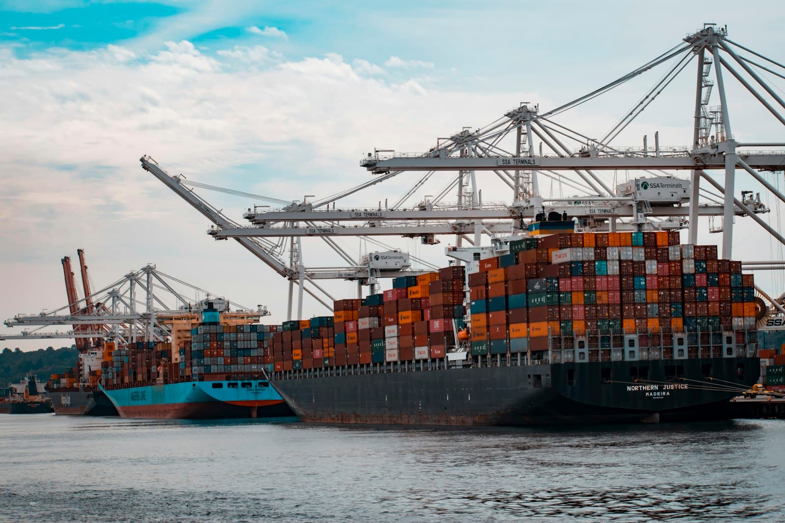 Overhead view of shipping containers and port infrastructure